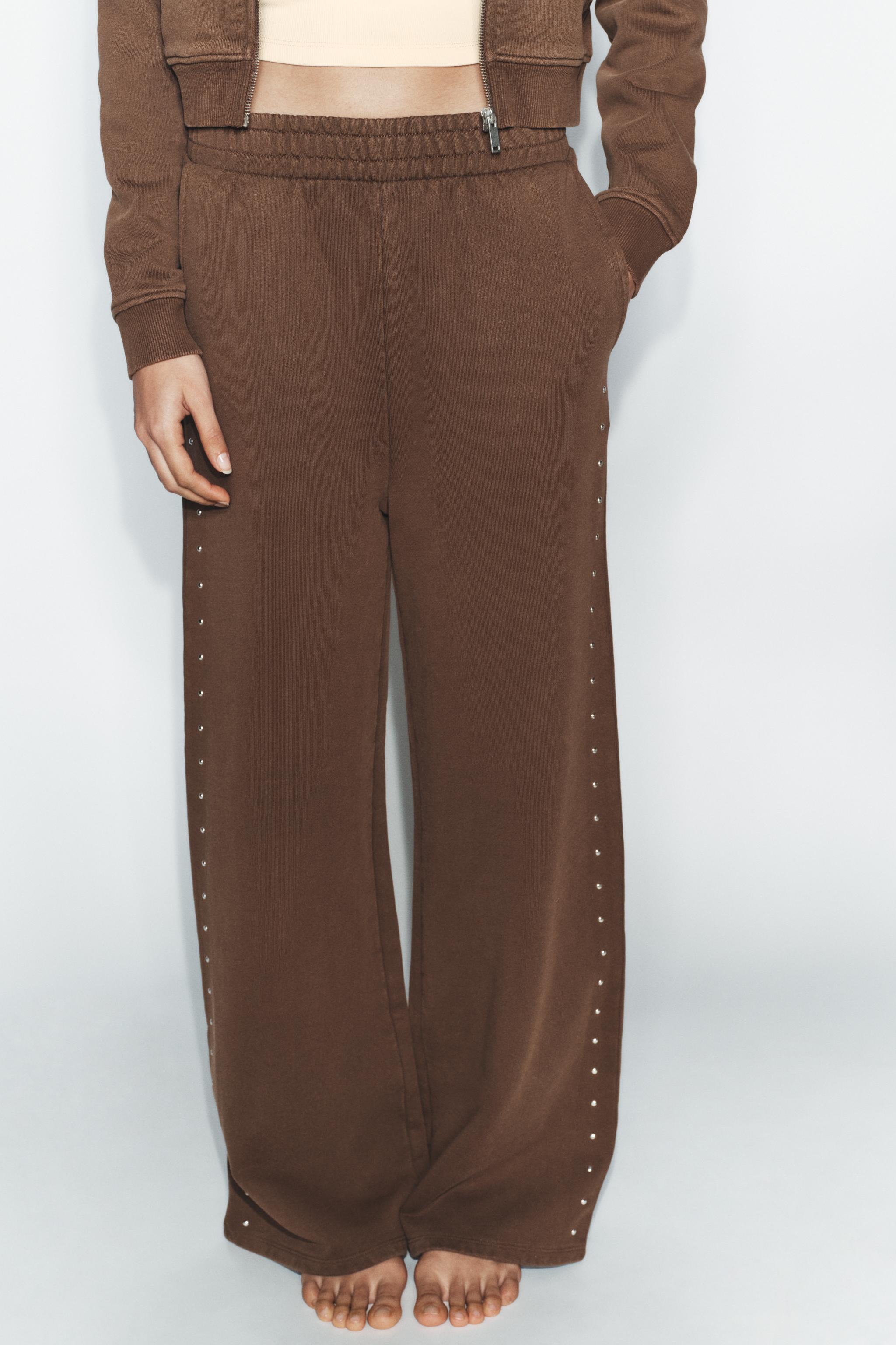 WASHED EFFECT FLEECE PANTS WITH STUDS